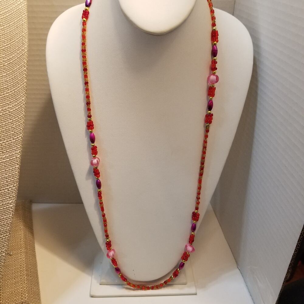 Thirty two inch pinks beads necklace with clear seed beads